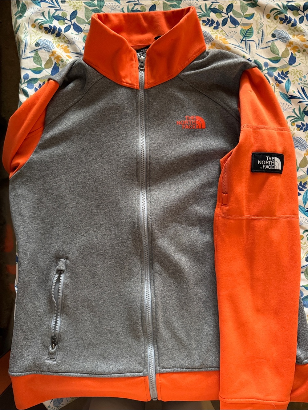 The North Face women’s gray & orange jacket size L.